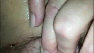 He likes playing with her hirsute cum-hole