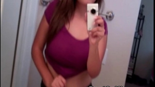 Busty legal age teenager honey shows her large milk shakes whilst taking selfie